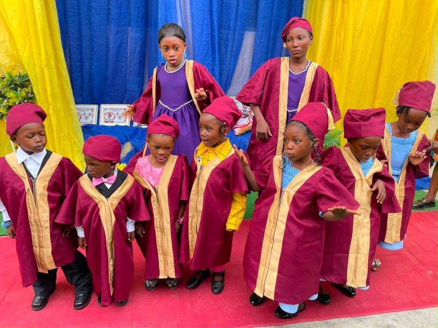 Our graduands in their maroon and gold gowns and caps